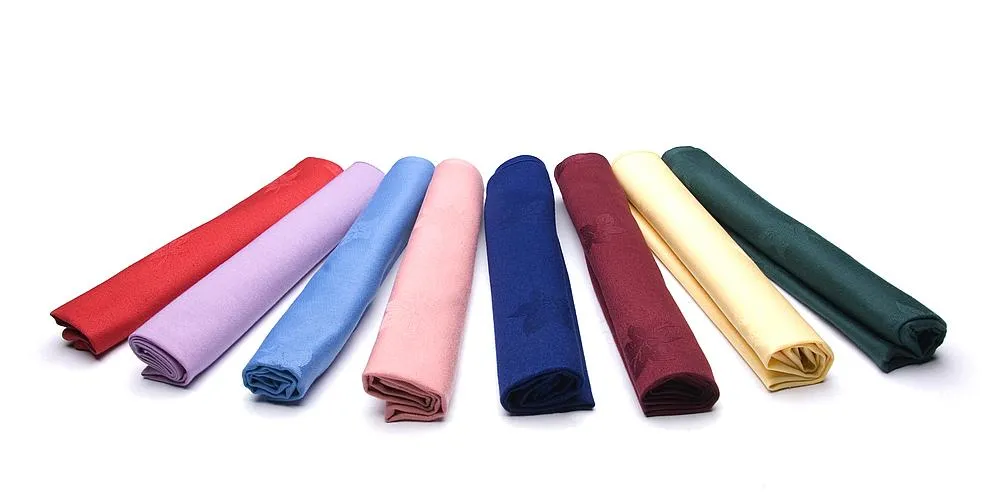 A close view of table linen, china and glassware