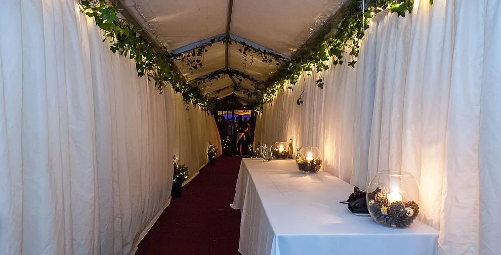 A marquee interior dressed for a wedding reception
