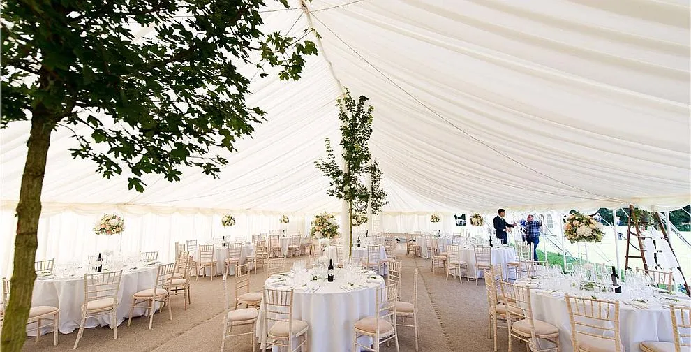 The interior of a traditional pole marquee showing the central pole