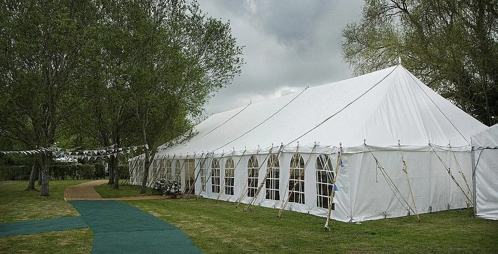 A traditional Shipseys marquee pitched on a lawn