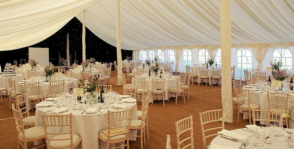 A wedding reception under way inside a marquee
