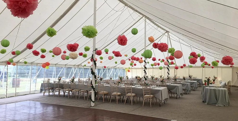 An unlined traditional marquee showing the natural canvas roof